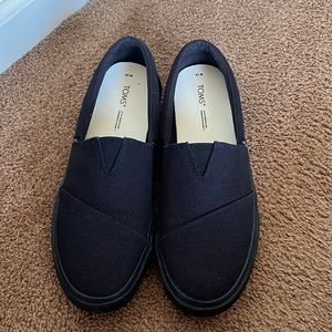 Black Toms slip on sneakers
